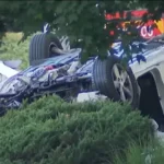 A damaged white Kia after a Maryland crash that killed one man and injured seven children